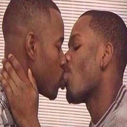 Two men kissing